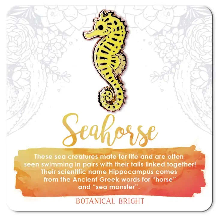 image of pin in the shape of a seahorse in yellow with black accents.  On a card with description in light orange and white