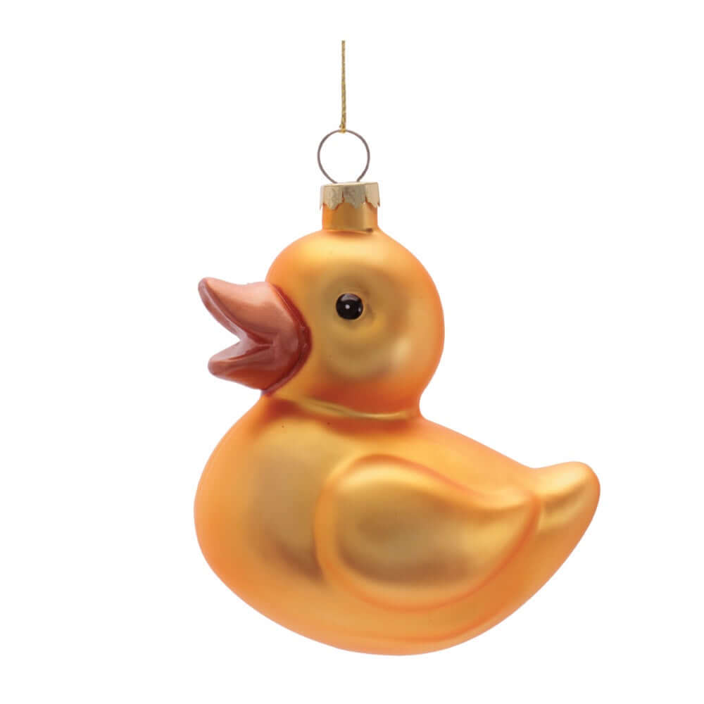 Yellow glass duck ornament on a white background