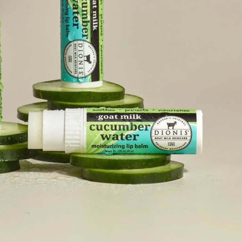 image of several slices of cucumber with a tube of lipbalm with a label in green and blue sitting on top