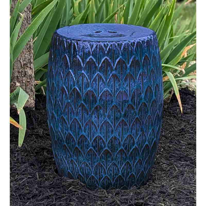 image of barrel shaped garden stool in deep blue with repeating leaf pattern.