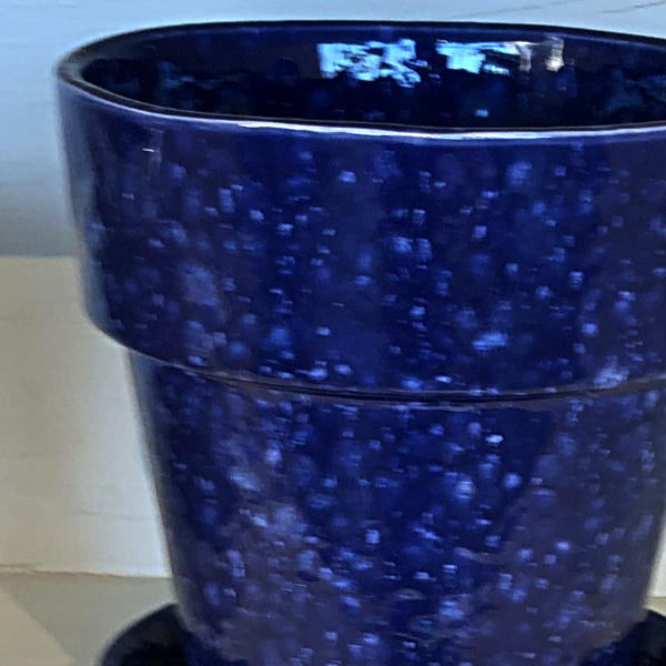 image of a ceramic flower pot in dark blue with light blue speckles
