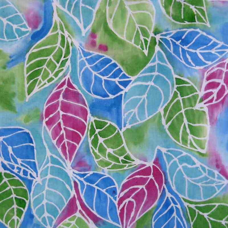 image of a piece of fabric with a multi color leaf design in blue green and dark pink