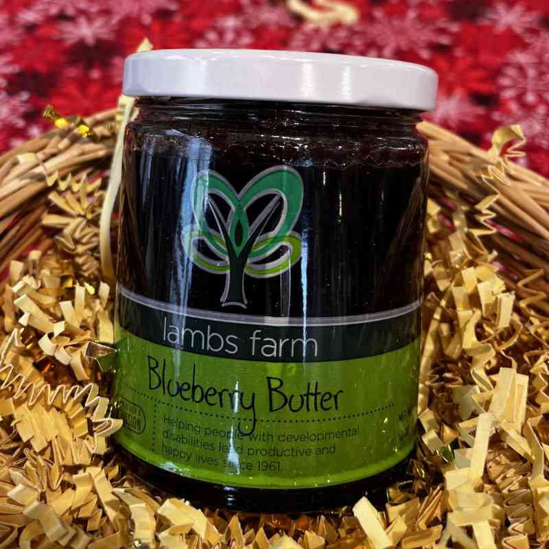 image of brown glass jar with white lid and green label with abstract green tree design