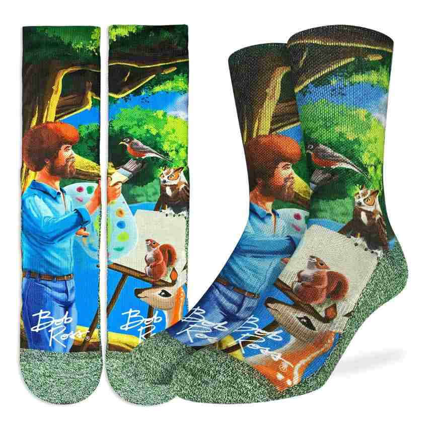 image of pair of socks showing a drawing of bob ross painting with images of a squirrel a robin an owl and a deer surrounding him