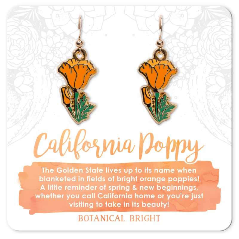 image of two earrings in the shape of orange poppy flowers on a cardboard backing
