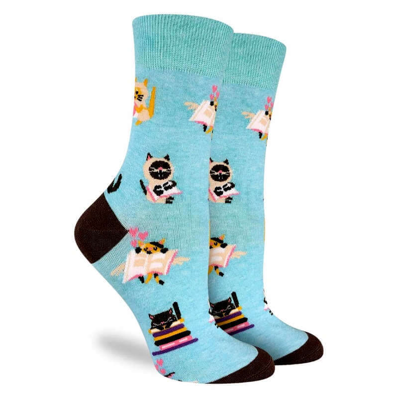 Light blue socks with cat designs on a white background