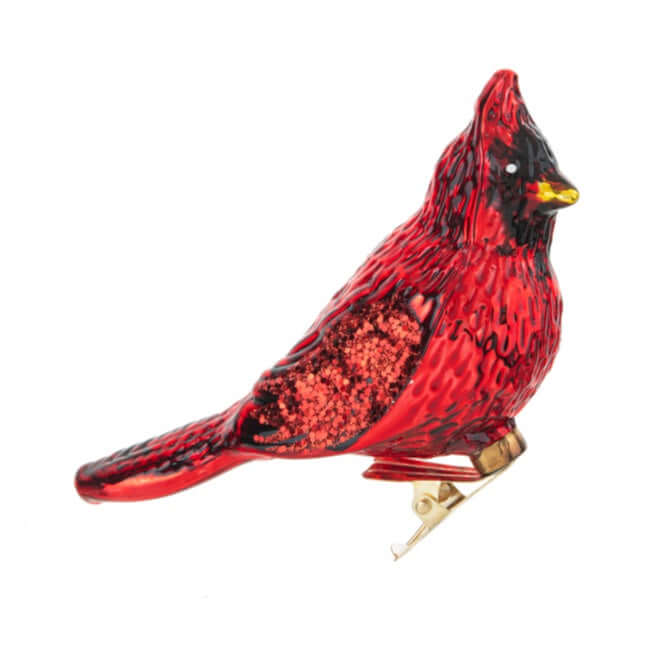 Red glass cardinal bird ornament on a white background