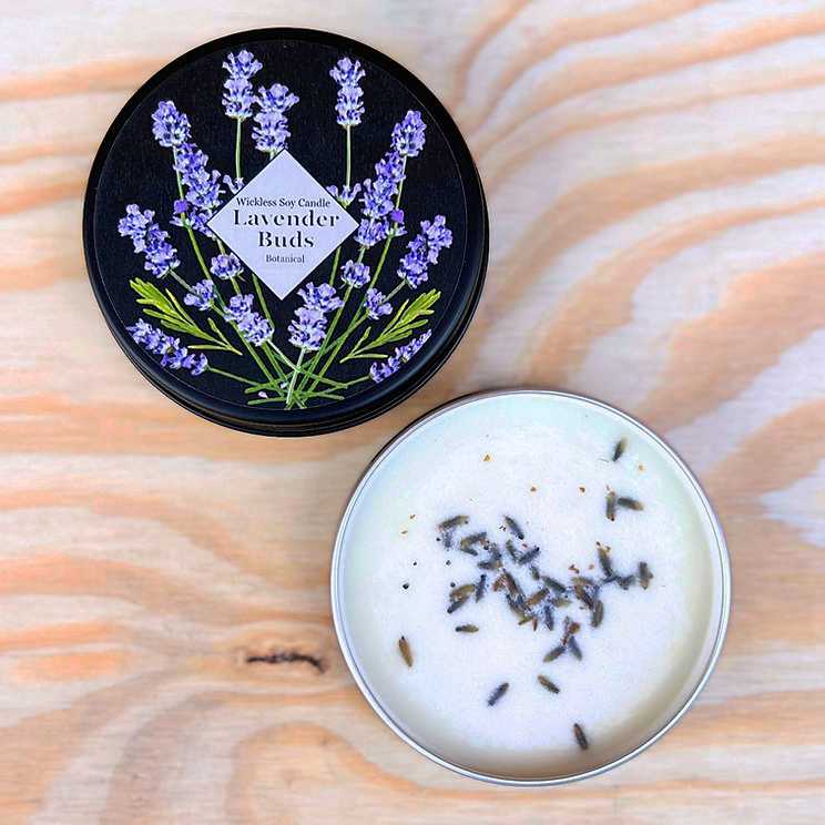 image of a black lid with drawings of lavender buds and the open bottom with white soy sprinkled with lavender seeds