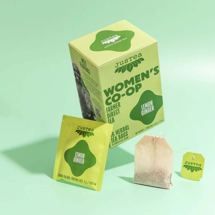 Justea Women's Co-op lemon ginger tea packaging on a light green background