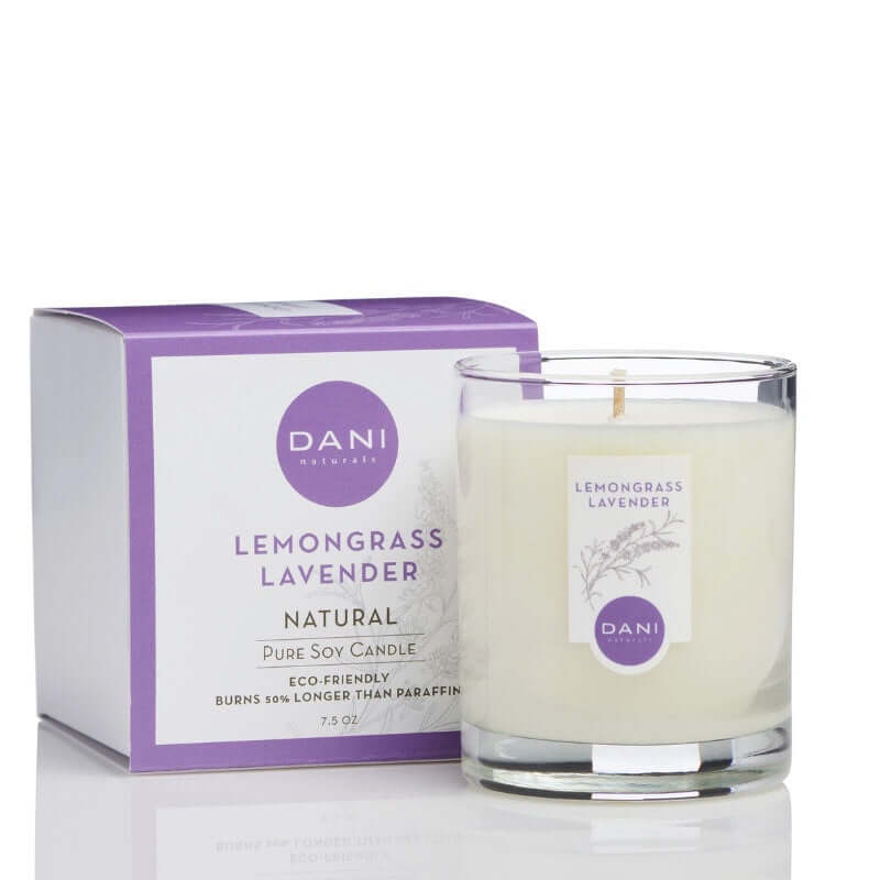 image of white candle in glass jar with light purple logo.  On the left is a square white box with logo and scent in light purple