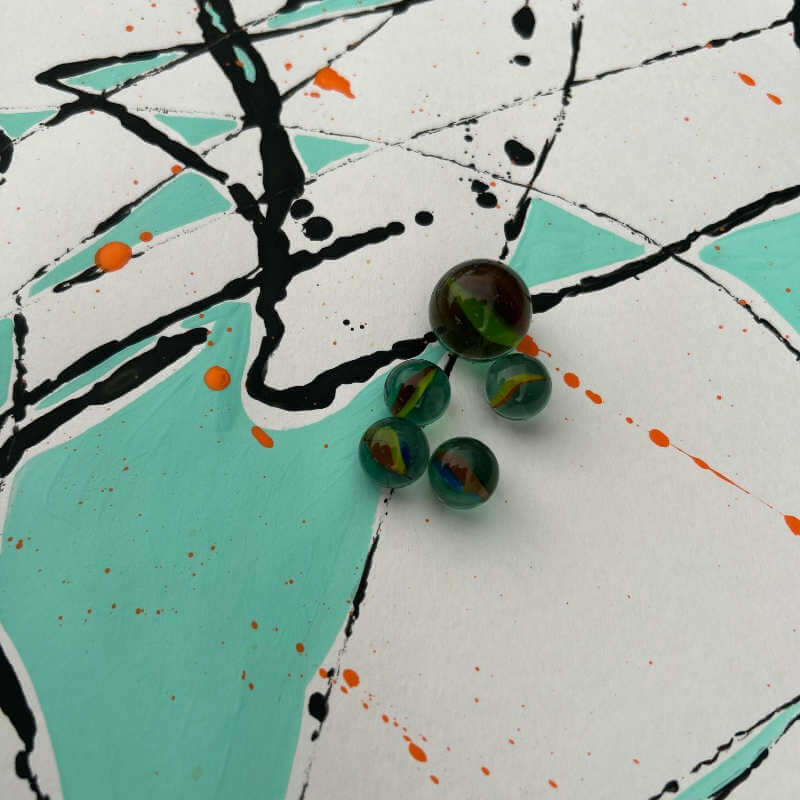 image of multi colored page with marbles on it