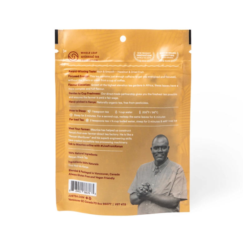 back side of tea pouch in gold with white and red lettering and a photo of a tea farmer in Africa