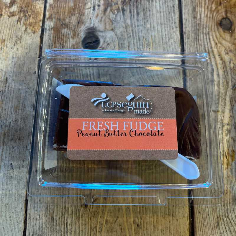 Packaged fresh fudge with a label on a wooden surface