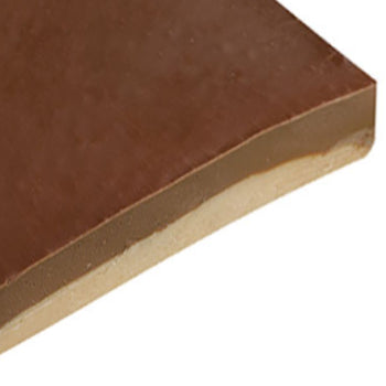 Packaged fresh fudge with a label on a wooden surface