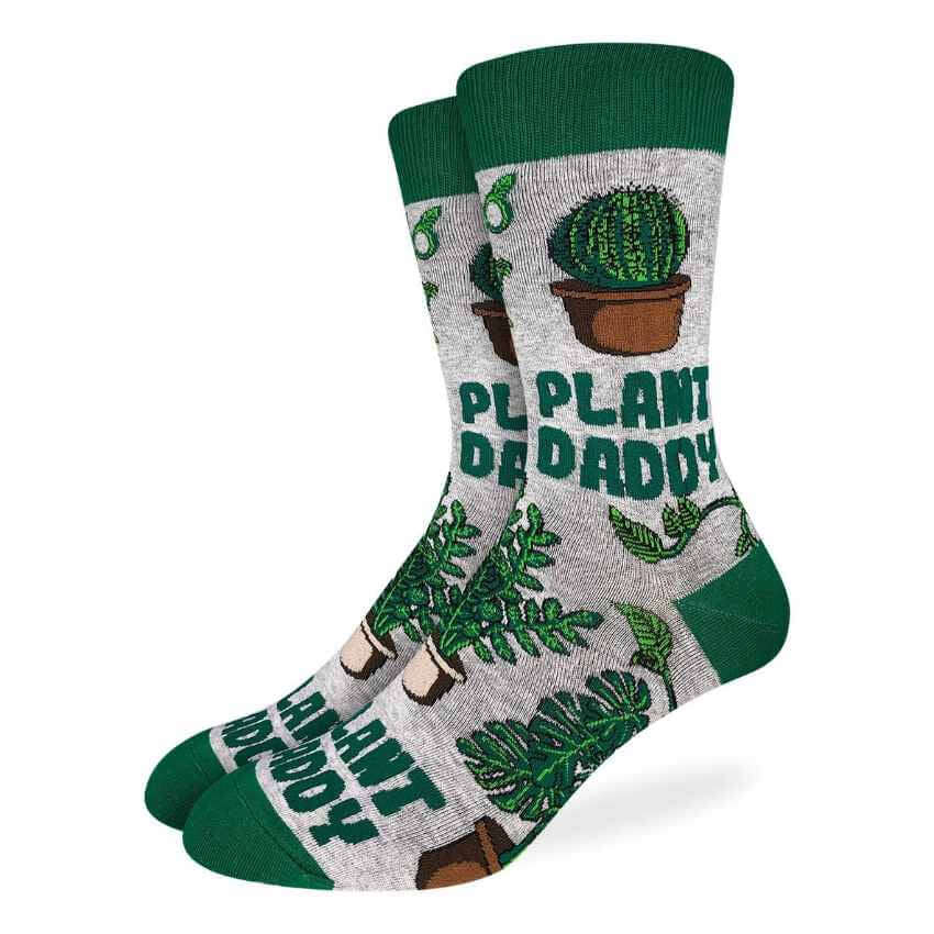 image of grey socks with green toe, heel and top edge with the words plant daddy in green and drawings of several plants