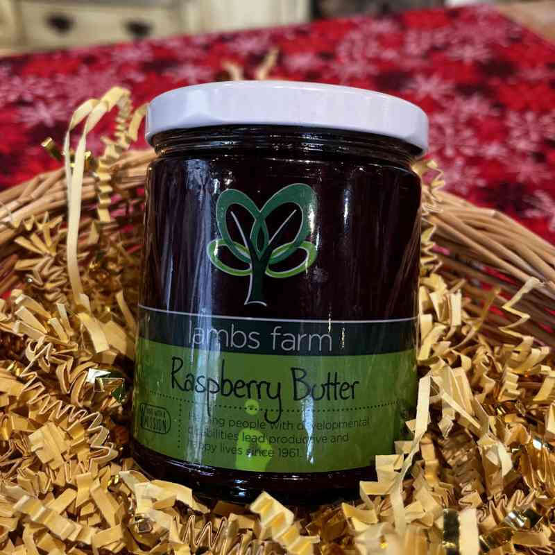 image of brown glass jar with white lid and green label with abstract green tree design