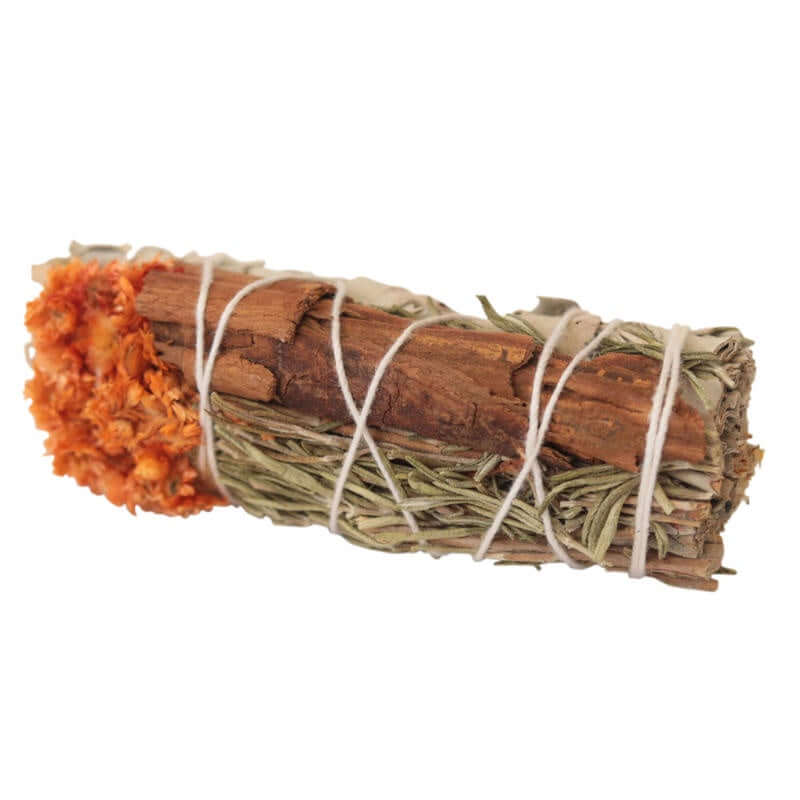 Bundled sage and cinnamon stick on a white background