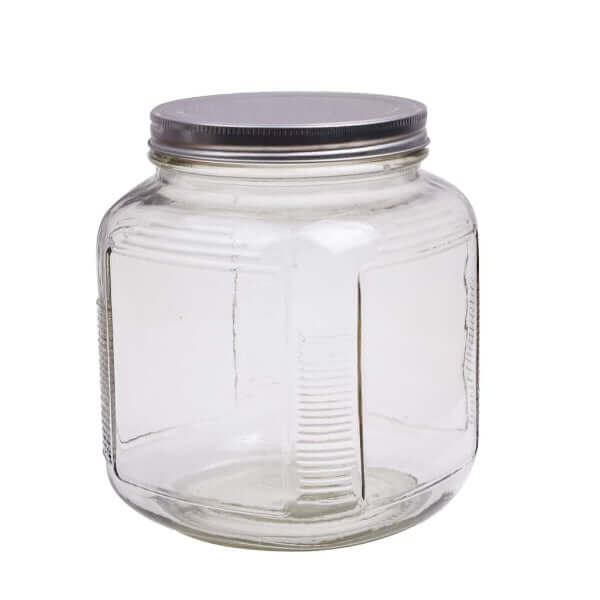 image of a glass jar in a rounded square shape with a silver metal screw top lid