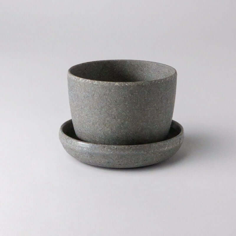 image of small round planter with saucer in a medium grey speckled finish