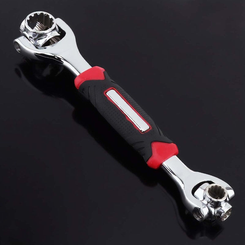 Wrench tool with red and black handle on a black background