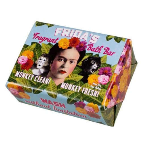 photo of rectangular bar of soap in paper wrapper with photo of Frida and monkey, and colorful flowers and leaves surrounding them