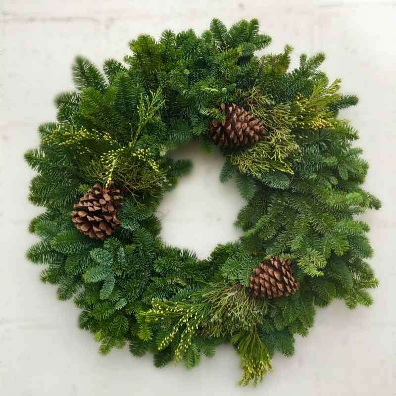 wreath with mixed evergreens and pine cones
