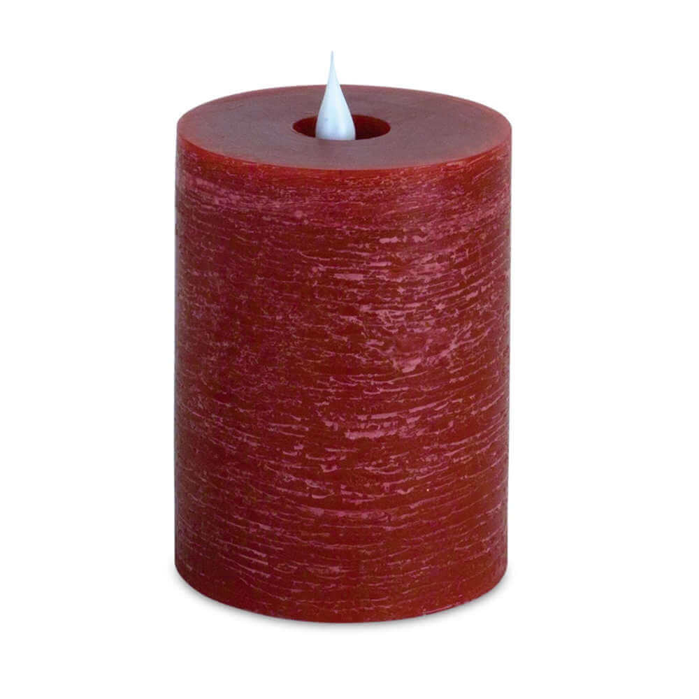 image of dark red column shaped candle with white pointed plastic flame in the middle of the top