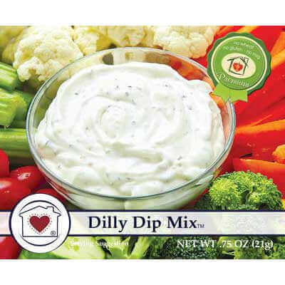 image of package label with a glass bowl of white dip with light green flecks surrounded by pieces of broccoli, celery, cauliflower, red peppers and small cherry tomatoes