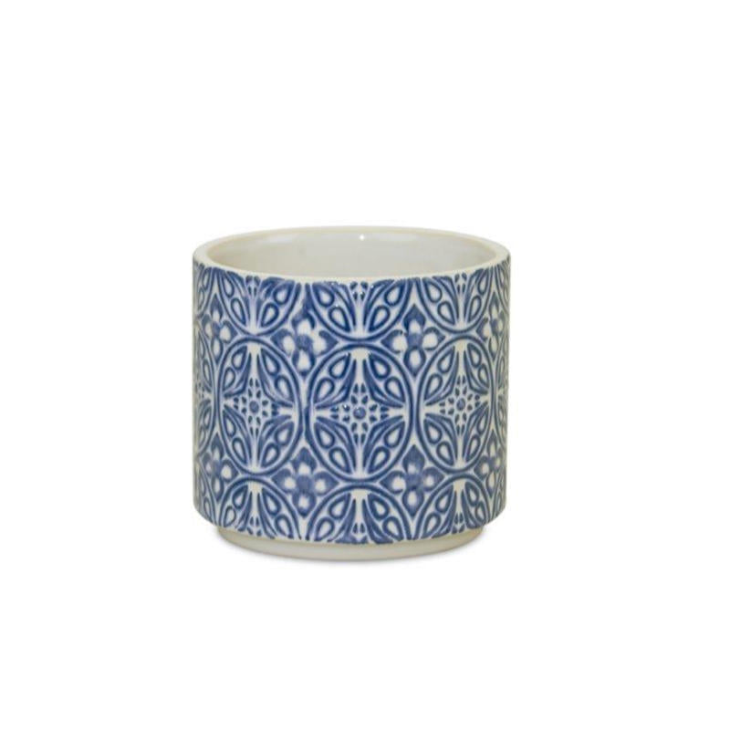 image of small white ceramic pot with delicate blue filigree design on the exterior.