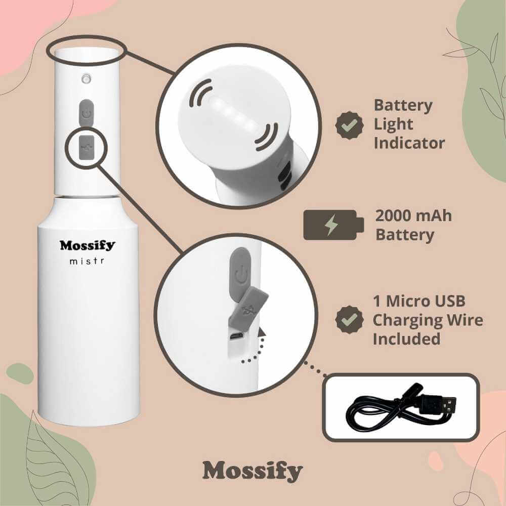 image of a hand holding a white cylindrical mister with a fine mist on it.  Logo on the front and green plants in the background