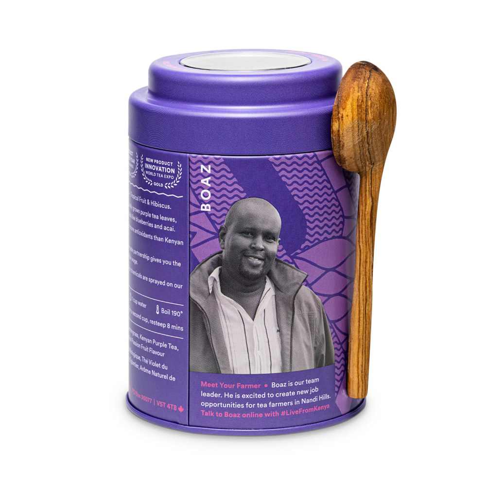 image of a round tea tin in a purple color with a carved wooden spoon, featuring a black and white image of Boaz, one of the tea farmers