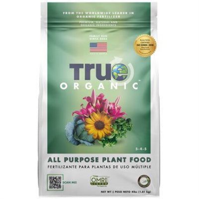 image of bag with true organic logo and images of flowers and vegetables on a green background on a light grey bag