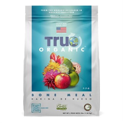 image of bag with true organic logo and images of fruits and flowers over a blue background on a light grey bag