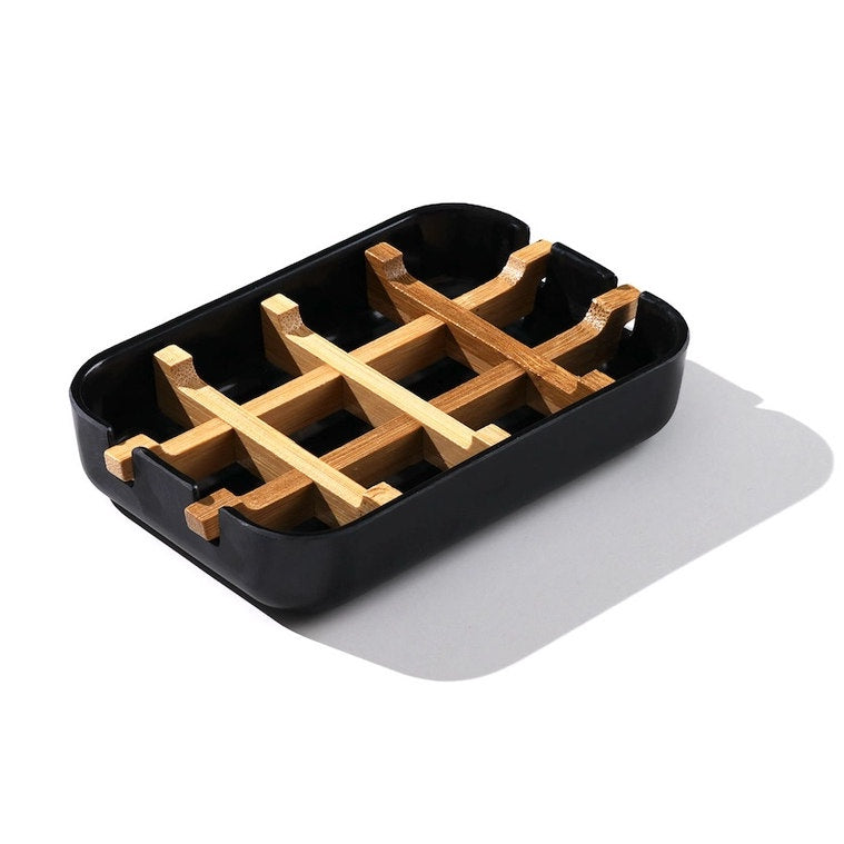 image of oblong soap dish in black with bamboo cross pieces in center