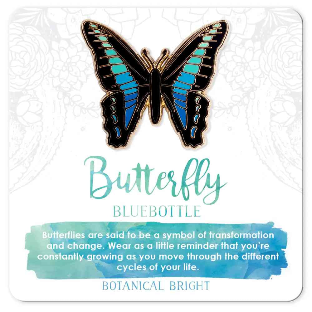 image of butterfly pin in shades of blue and aqua down the middle of the wings, with black on the edges.  On a card with description