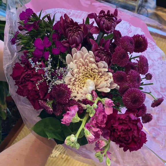 image of a bouquet with dark purple and pink flowers