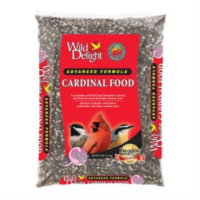 image of clear plastic bag filled with birdseed and with a bright red label and pictures of 3 birds