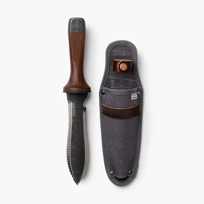 photo of hori hori knife with wide metal blade and wooden handle, next to a grey waxed canvase belt holster for the hori hori