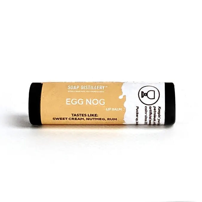 image of a tube of lip balm with a white and golden yellow label
