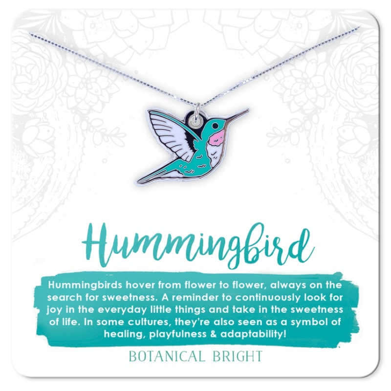 image of enamel hummingbird charm in aqua with white and pink accents on a thin silver chain on a white card with aqua writing
