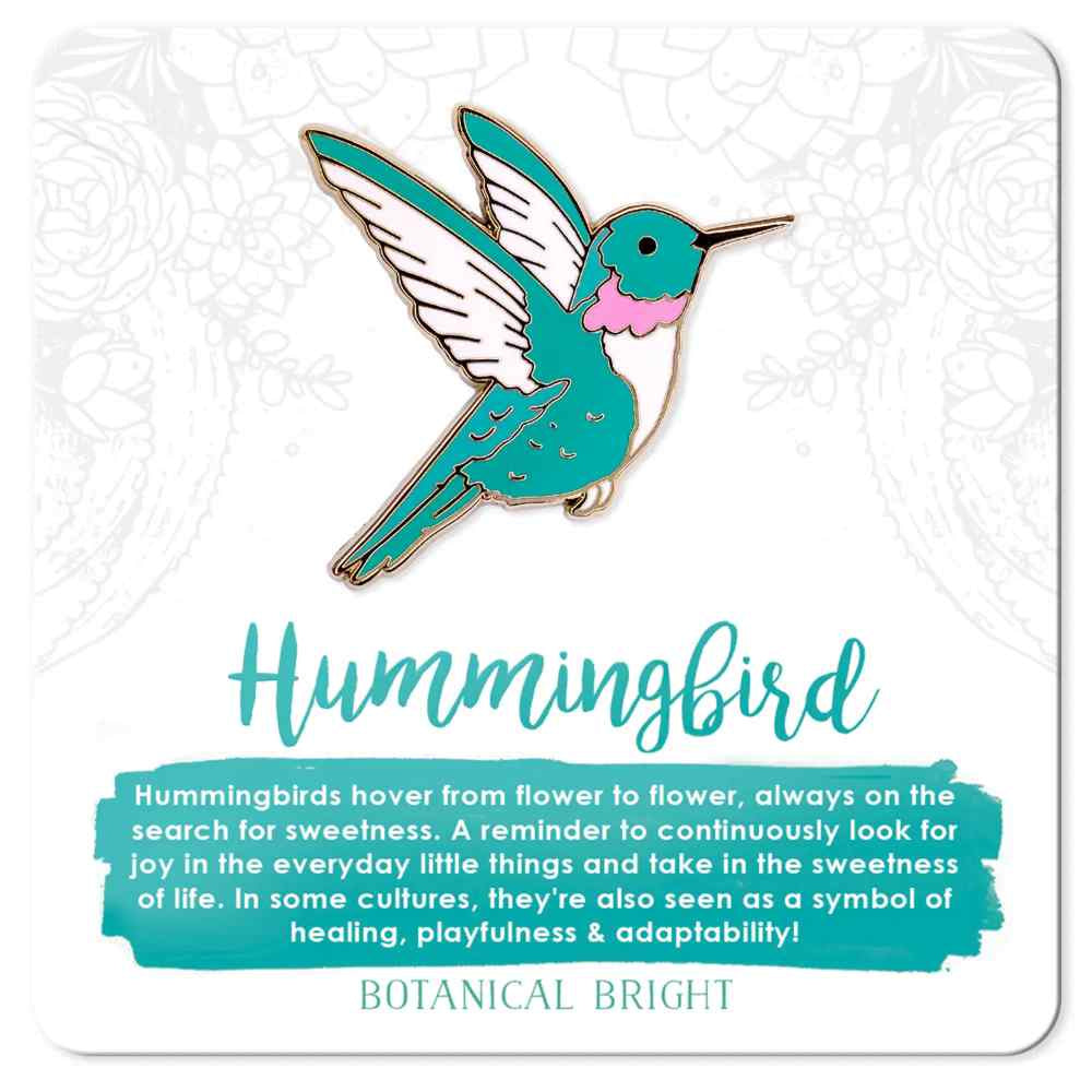image of hummingbird pin in aqua with white and pink accents.  On a card with description