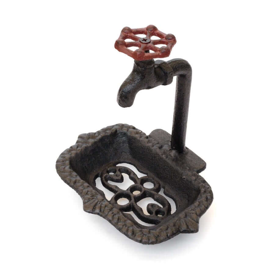 image of brown iron soap dish with a fake faucet attached to side and sitting above
