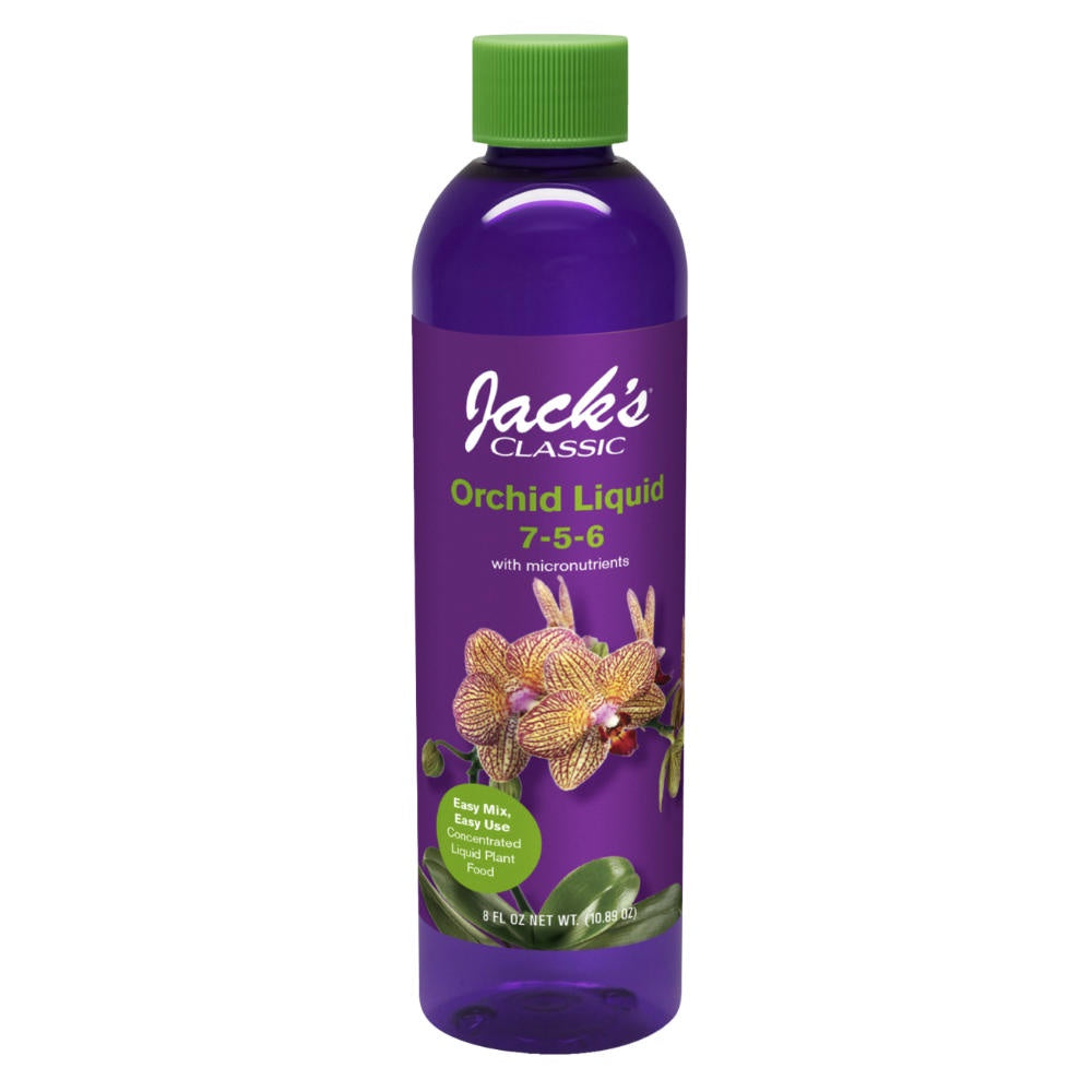 image of a tall slender round bottle in a purple color with a photo of an orchid on it, and Orchid Liquid 7 5 6 on the label