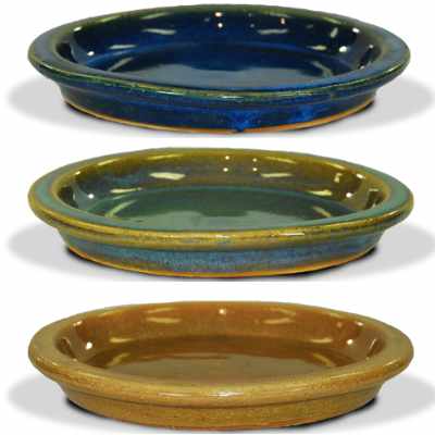 image of blue, green and gold glazed saucers