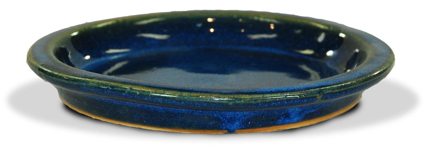 image of blue, green and gold glazed saucers