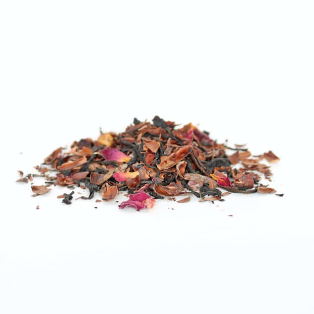 image of a small pile of dried tea leaves in colors of dark brown, golden brown, pink and yellow