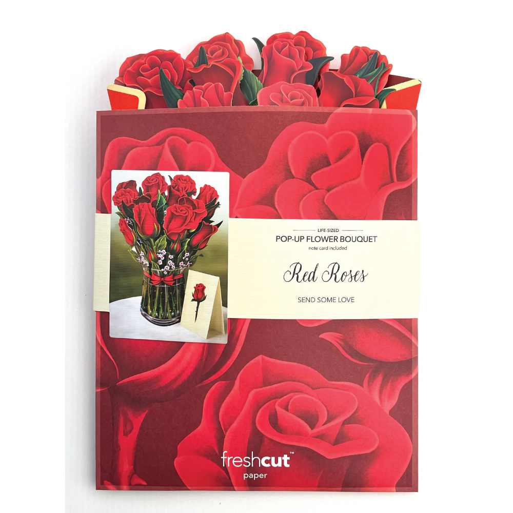 image of flattened bouquet peeking up from the large envelope.  Envelope has a large image of roses in medium and dark red and a photo of the paper bouquet fully opened