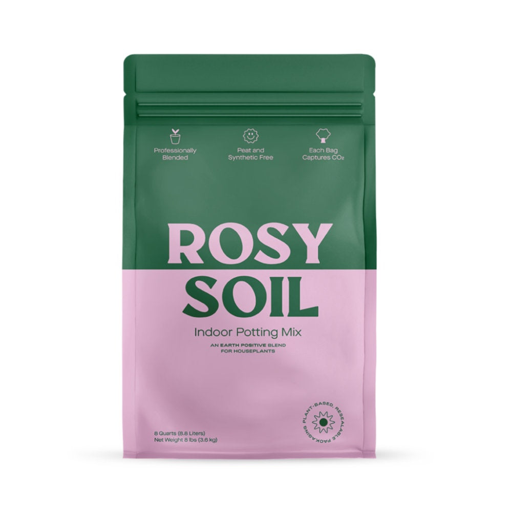 image of vertical rectangular bag.  Top half is dark green with light pink "rosy" written and bottom half is light pink with "soil" and indoor potting mix in dark green