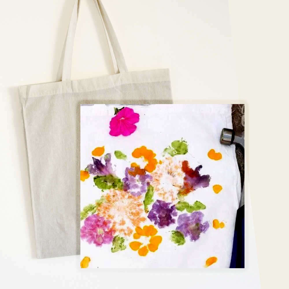 image of an off white canvas tote bag, with an image of a piece of white fabric decorated with flower patterns